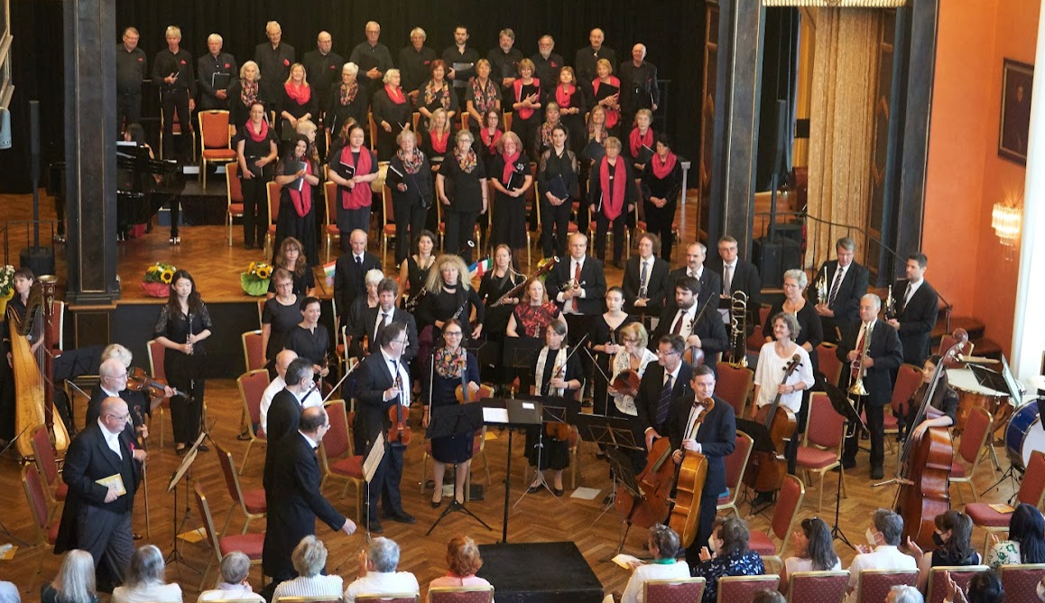 View from above of a stage with orchestra and choir.
