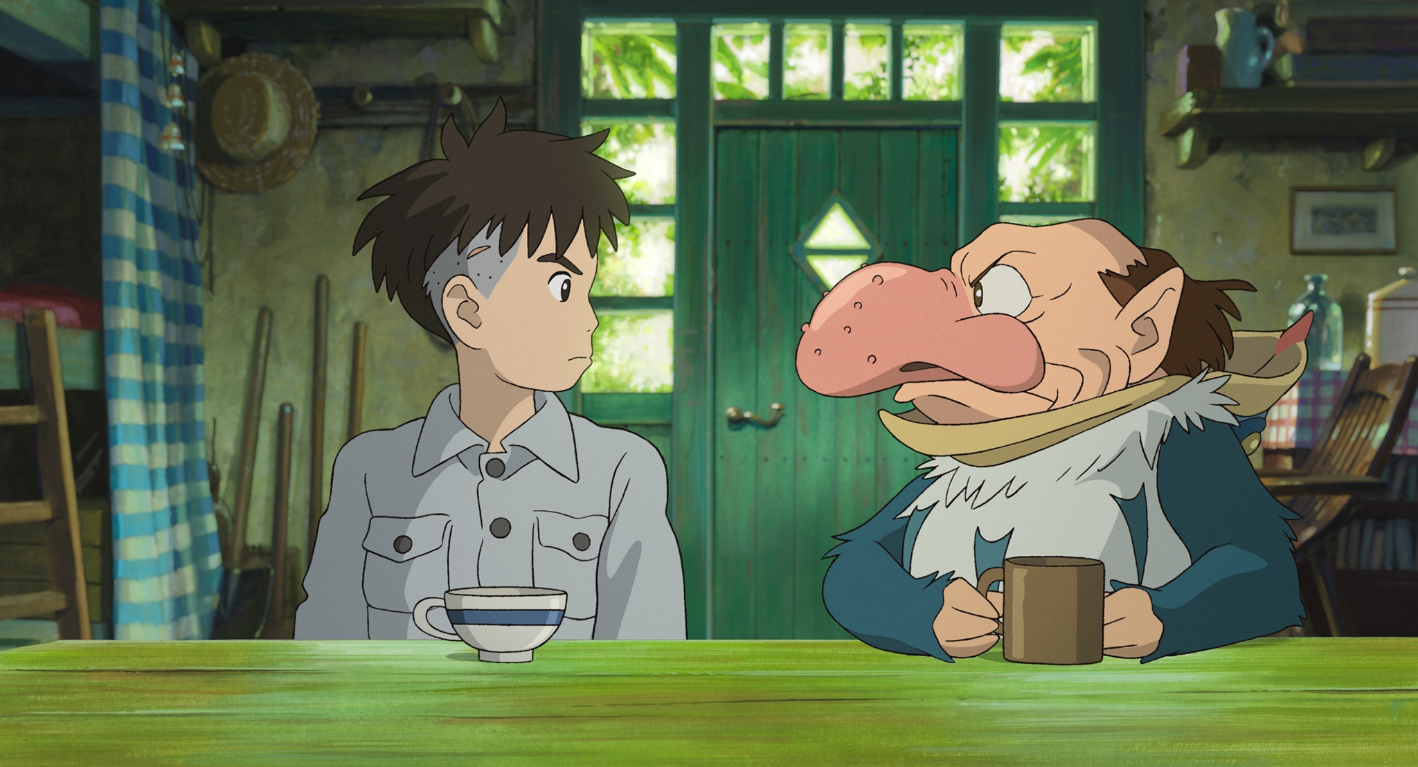 Animation of a boy and a figure that looks like a mixture of heron and human. They are sitting at a counter drinking tea.
