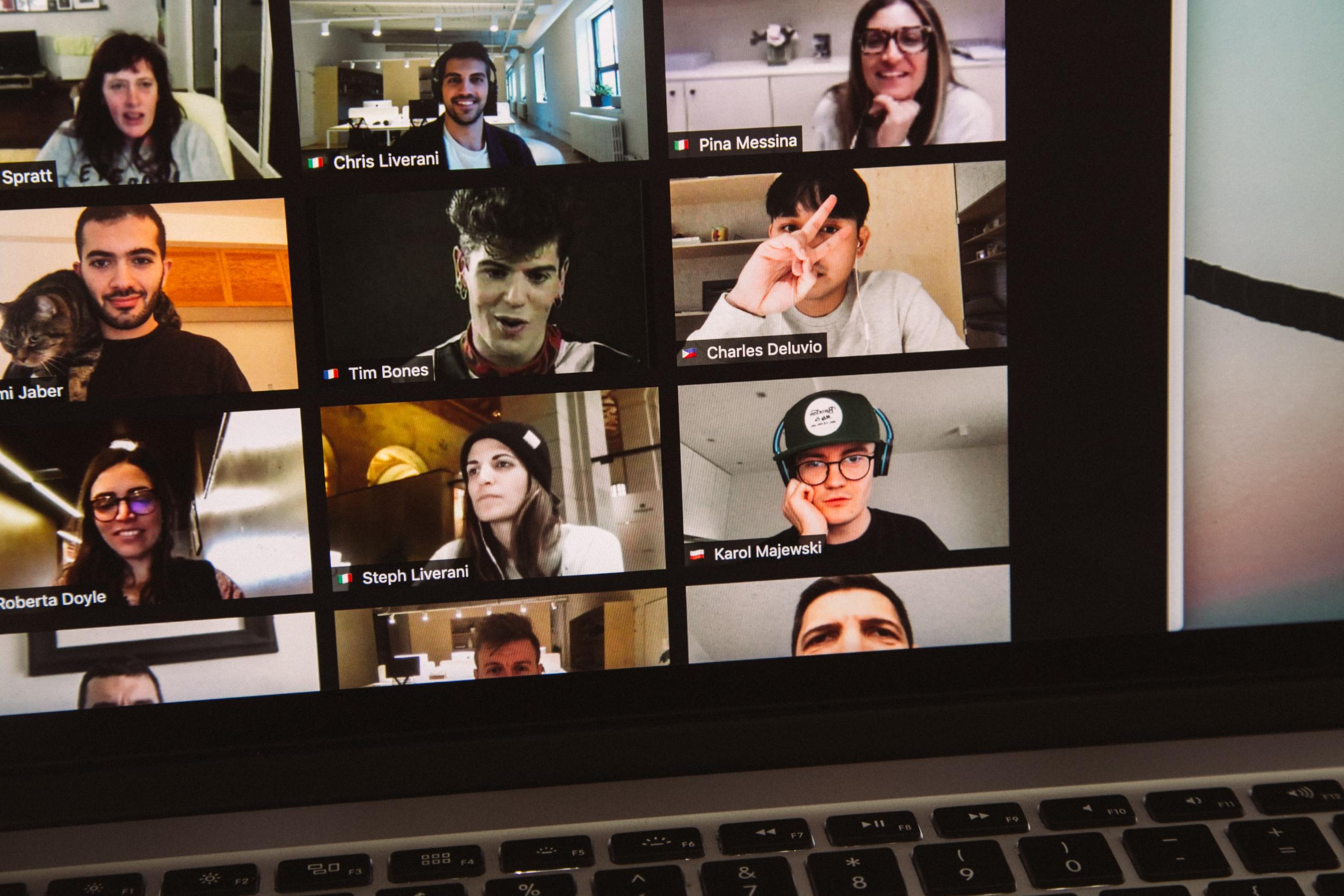 People in a video call on a laptop screen